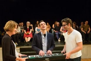 Joel Ripka (center) with audience members (left and right) during Every Brilliant Thing.